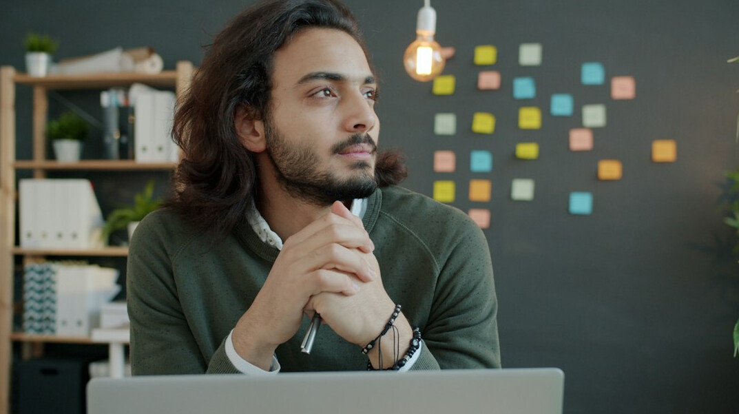 person thinking at desk